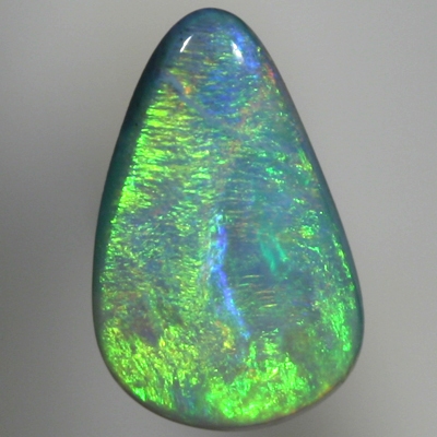 SOLID SEMI BLACK OPAL Glowing with bright greens over a beautiful blue